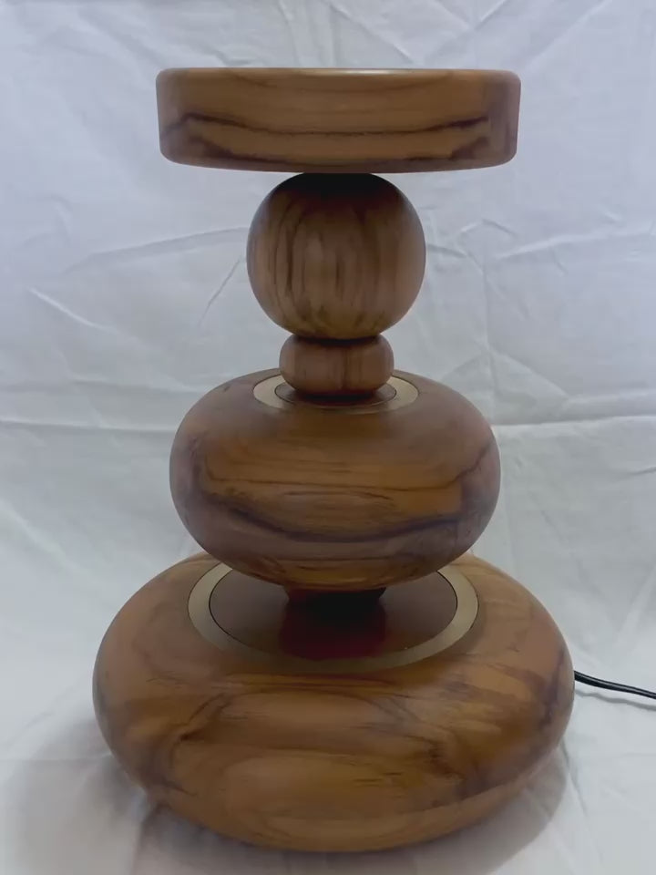 video of aikya table lamp by advit design lab - made of teak wood and brass rings